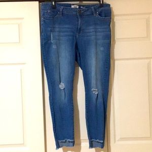 Women’s distressed blue jeans.